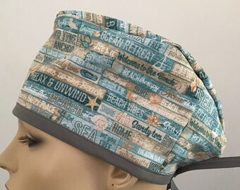 UNISEX SCRUB CAP featuring coastal words of happiness print, back ties for adjusting fit, availability is limited