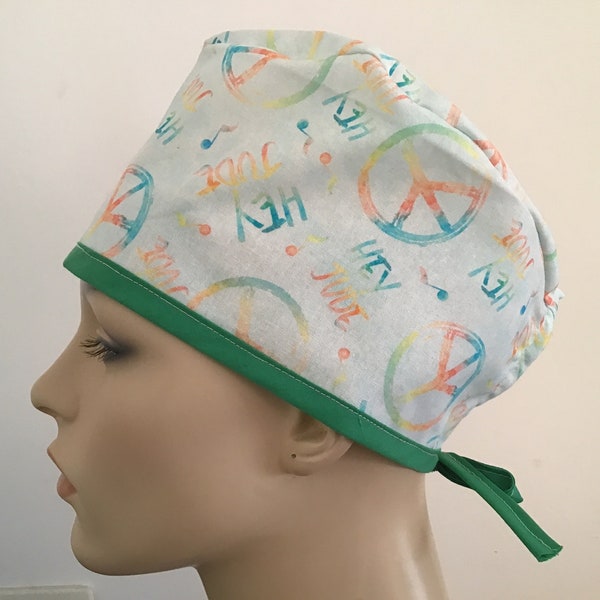 UNISEX SCRUB cap featuring a musical & peaceful print, back ties for adjusting fit, limited availability