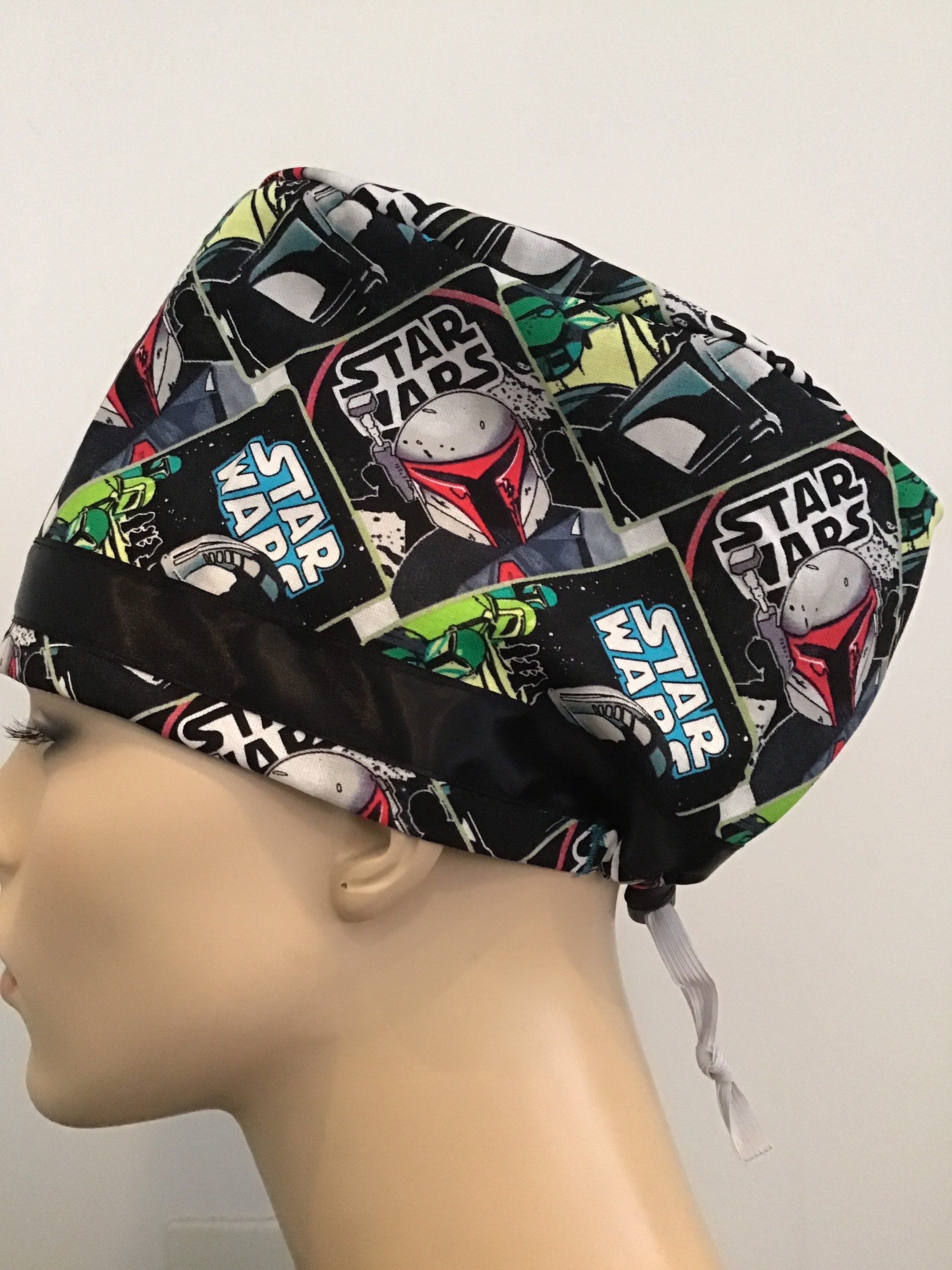 SCRUB CAP FEATURING a satin ribbon on the iconic girl print, do not miss  out on this one, limited availability