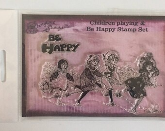 Girls playing and Be Happy sentiment stamp