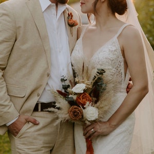 Rust/burnt orange boho bridal bouquet arrangement. Terracotta wedding bouquet, dried bouquet. Dried floral arrangement.