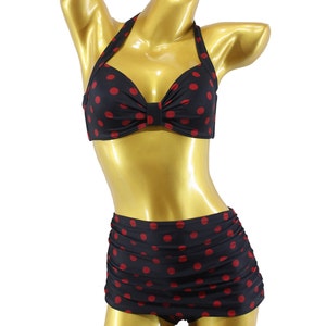 May include: A black and red polka dot bikini with a halter top and high-waisted bottoms.