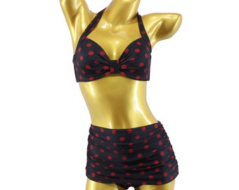 May include: A black and red polka dot bikini with a halter top and high-waisted bottoms.