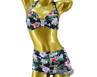 May include: A black and green floral print bikini top and matching high-waisted skirt. The bikini top has a halter style with a bow in the front. The skirt has a high waist and a ruffled hem. The bikini is made of a soft, stretchy fabric.
