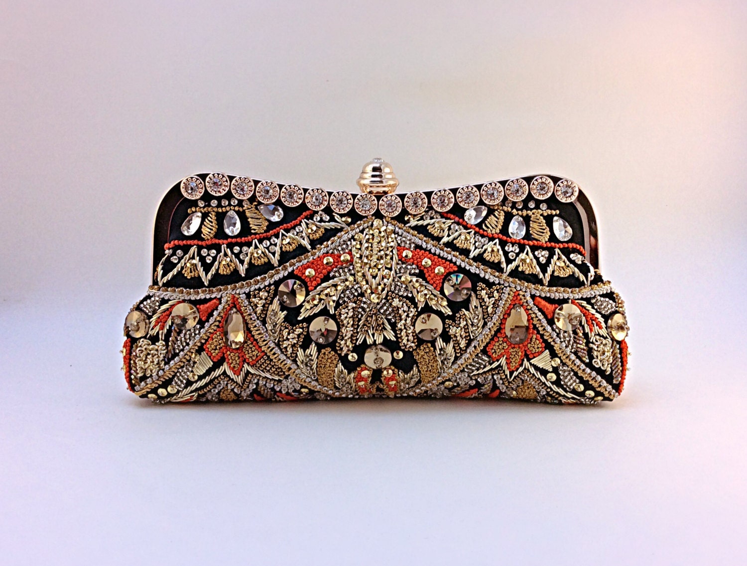EMBELLISHED ZIP TOP CLUTCH WITH STRAP ORDER OF DISORDER