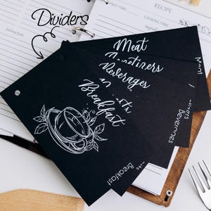 May include: Black dividers for a recipe binder with white text. The dividers are labeled "Breakfast", "Meat", "Main Dishes", and "Beverages".
