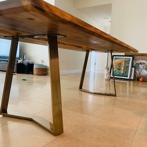 Trapezoidal table legs in an eye-catching brushed gold finish.  Shiny legs in gold powder coat look amazing with epoxy river table or live edge wood top.  The oak top combined with the YAKO trapezoidal legs will be your favorite dining room table.