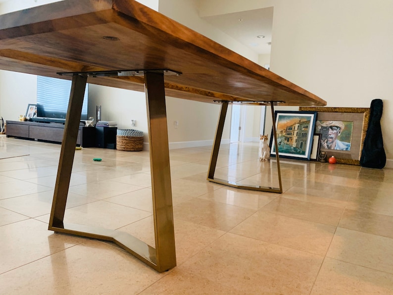 Trapezoidal table legs in an eye-catching brushed gold finish.  Shiny legs in gold powder coat look amazing with epoxy river table or live edge wood top.  The oak top combined with the YAKO trapezoidal legs will be your favorite dining room table.