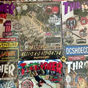 May include: A collage of skateboarding-themed stickers and magazine covers. The image features logos like Thrasher, Independent, and DC Shoes. A skater is captured mid-air. The phrase "Shit is Weak" is visible.