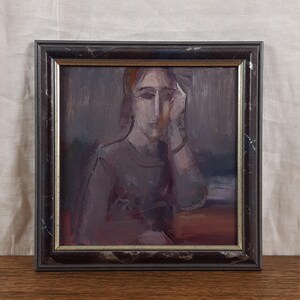May include: Oil painting portrait of a person in a dark frame. The subject is depicted with a hand on their face, with a somber expression. The color palette is dominated by muted tones of purple, brown, and red.