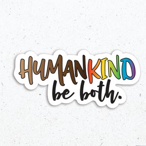May include: A sticker with the text "HUMANKIND be both." in rainbow colors. The text is written in a handwritten style. The sticker is on a white background.