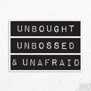 May include: Black and white typography print with the text "Unbought Unbossed & Unafraid".
