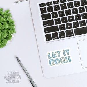 May include: A white laptop computer with a blue and white sticker that says "Let it Gogh" on the top right corner of the trackpad. The sticker has a floral pattern.