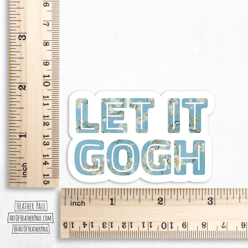 May include: A blue and white sticker with the text "Let it Gogh" in a stylized font. The letters are filled with a pattern reminiscent of a famous painting.