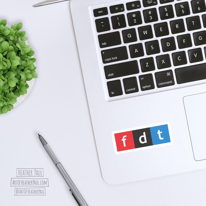 sticker featuring parody of the NPR logo with the letters fdt mocked up on a laptop computer