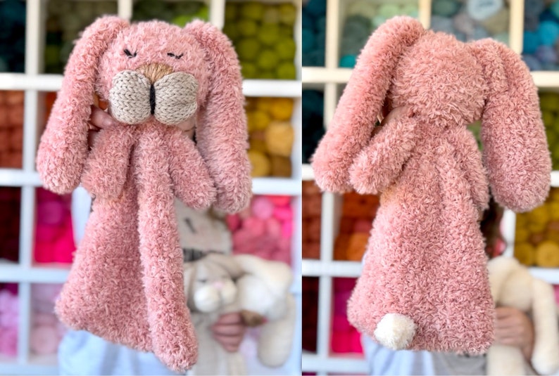 May include: A plush pink bunny toy with long floppy ears and a knitted beige nose and mouth. The bunny has a fluffy, textured body and a small white tail. The toy is designed to be held and cuddled.