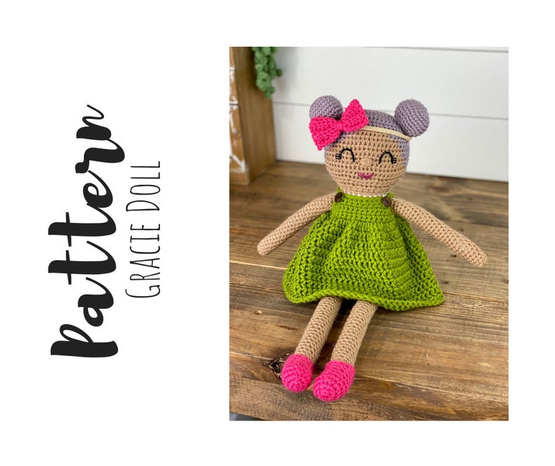 Crochet doll wearing a green dress, pink shoes and purple hair. Listing is for a crochet doll pattern and not the finished piece.