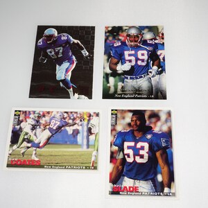 May include: Four New England Patriots football trading cards. The cards feature players Jon Coates, Vincent Brown, Chris Slade, and a fourth player whose name is not visible. The cards are from the 1993 Score football card set.
