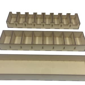 May include: Three wooden storage boxes with dividers. The top box has 10 compartments, the middle box has 6 compartments, and the bottom box has no dividers.