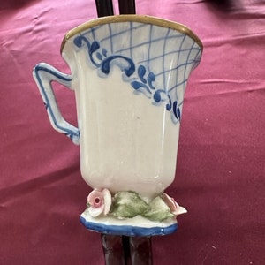 Unusual Gold Rimmed Teacup 3D roses around the base