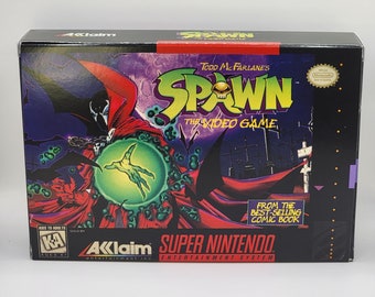 May include: A black and red video game box for the Super Nintendo Entertainment System. The box features a character called Spawn, a red and black figure with a skull on his chest, holding a green orb. The text on the box reads "Todd McFarlane's Spawn The Video Game" and "From the Best-Selling Comic Book".