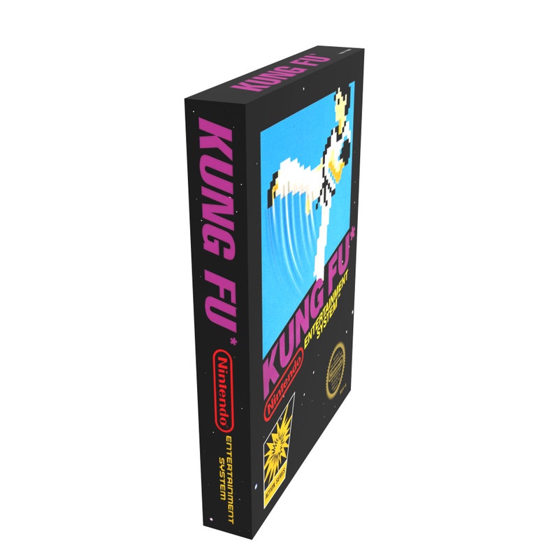May include: A black Nintendo Entertainment System game cartridge with a pink and white label. The label features the text "KUNG FU" and a pixelated image of a person performing a martial arts move.
