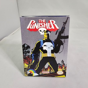 May include: The Punisher video game box art features a black and white illustration of the Punisher, a skull logo, and the text "The Punisher". The background is a dark gray with a cityscape.