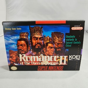 May include: A box for the Super Nintendo game Romance of the Three Kingdoms II. The box features a colourful illustration of four warriors in armour and helmets. The game is licensed by Nintendo and published by Koei.
