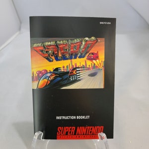 May include: A black and white instruction booklet for the Super Nintendo Entertainment System game "Aero the Acrobatic Squirrel". The cover features a colorful illustration of Aero's futuristic vehicle speeding down a highway.