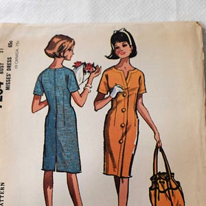 May include: Vintage McCall's sewing pattern, featuring illustrations of two dresses. The pattern, labeled 7254, includes a size 10 and bust 31 measurement. The cover art showcases a blue and an orange dress design, with the word "Quickie" at the bottom.