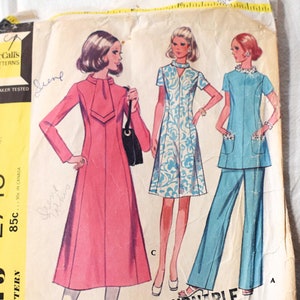 May include: Vintage McCall's sewing pattern for a half-size dress in two lengths or a top and pants. The pattern number is 2748 and the size is 18 1/4, bust 41. The pattern is non-returnable.