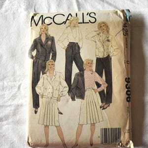 May include: Vintage McCall's sewing pattern envelope featuring illustrations of women's suits and separates. The envelope shows a variety of outfits, including blazers, skirts, and pants. The pattern number is 9306.