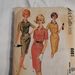 May include: Vintage McCall's sewing pattern for a misses' dress. The pattern number is 6081. The pattern is for sizes 14 and 34 bust. The pattern is printed on a white background with a brown border. The pattern shows three women wearing different versions of the dress.