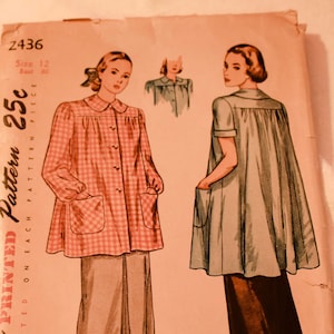 May include: Vintage Simplicity sewing pattern number 2436 for a dress with a gathered bodice and short sleeves. The pattern is printed on pink paper and features two illustrations of women wearing the dress. The pattern is priced at 25 cents.