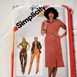 May include: Simplicity sewing pattern number 300 for a dress with a button-down front and a belt. The pattern includes instructions for three different styles: a dress with a skirt, pants, and a jacket. The pattern is specially marked for adjustments to Miss Petite sizes.