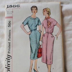 May include: Vintage Simplicity sewing pattern number 1886 for a dress. The pattern is for a size 14, bust 35, and costs 50 cents. The pattern shows two women wearing dresses, one in a blue and white gingham print and the other in a pink dress. The pattern is printed on a white background.