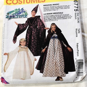 May include: McCall's Costumes sewing pattern for medieval magic costumes. The pattern includes three different costumes: a long purple dress with a cape, a white dress with a cape, and a long white dress with a cape. The pattern is for sizes X-Small through Large for misses and sizes 2 through 12 for girls.