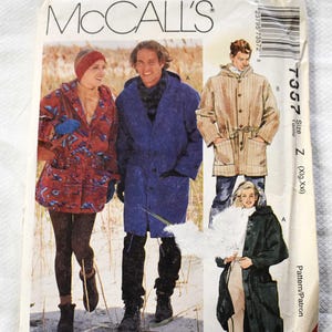 May include: A vintage McCall's sewing pattern envelope with illustrations of coats. The envelope shows a red patterned coat, a blue coat, and a tan coat. The text "McCall's" is prominently displayed.
