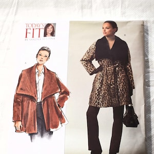May include: A Vogue Patterns sewing pattern featuring illustrations of a coat and jacket. The coat has a leopard print design with a black collar and belt. The jacket is a solid brown color. The pattern includes the text "TODAY'S FIT" and "V1024".