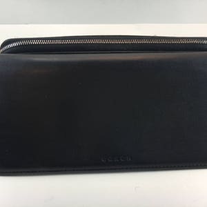 Cartera organizadora de mano con cremallera y tres pliegues en negro de Coach VTG