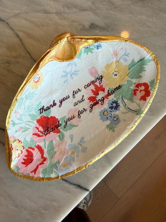 A real shell transformed into a cheeky trinket dish with a wink of humor — handmade decoupage with a punny message that makes it both useful and conversation-starting.