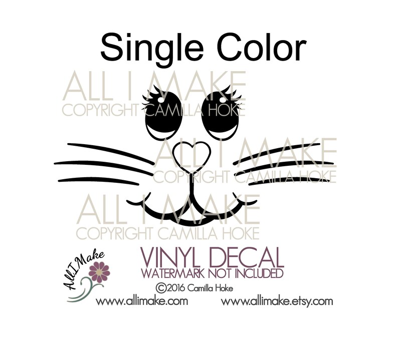 May include: Black and white single color vinyl decal of a cat face with large eyes, a heart-shaped nose, and whiskers. The decal says "ALL I MAKE COPYRIGHT CAMILLA HOKE" at the top and bottom.