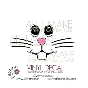 May include: A black and white bunny face design with a pink heart-shaped nose, whiskers, and large eyes with eyelashes. The text "VINYL DECAL" is below the design. The image also includes the text "All I Make" and website information.