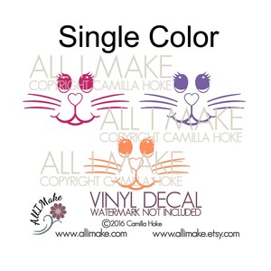 May include: Three single-color cat face vinyl decals in pink, purple, and orange. The decals feature a heart nose, eyelashes, and whiskers. The text "VINYL DECAL WATERMARK NOT INCLUDED &copy;2016 Camilla Hoke www.allimake.com www.allimake.etsy.com" is at the bottom of the image.