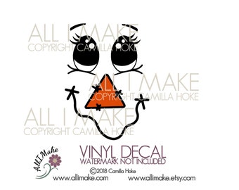 May include: A black and white cartoon face with large eyes and a triangle nose. The nose is orange and has a black outline. The face is surrounded by the text "ALL I MAKE" and "COPYRIGHT CAMILLA HOKE".