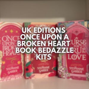 May include: UK Editions of "Once Upon a Broken Heart" and "A Curse for True Love" book kits. The books have red and pink covers with floral and heart designs. The author's name, Stephanie Garber, is visible.