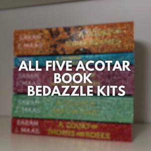 May include: A stack of five books with sparkly covers. The books are all by Sarah J. Maas and are part of the A Court of Thorns and Roses series. The text "ALL FIVE ACOTAR BOOK BEDAZZLE KITS" is written in white letters on a blue background.