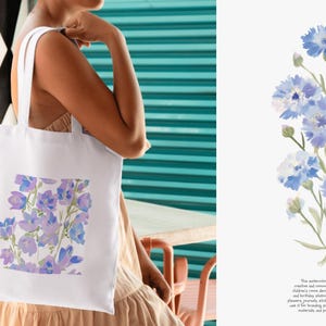 May include: White tote bag featuring a watercolor floral design in shades of blue and purple. The tote bag is carried by a person. A separate watercolor illustration of blue flowers is also visible.