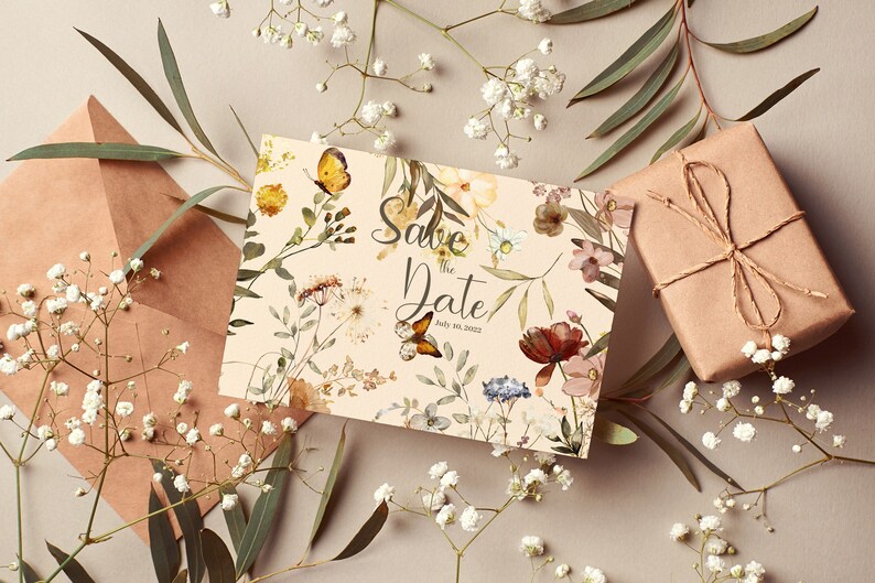 May include: A save the date card with a floral design featuring butterflies and the text "Save the Date!" with the date "July 08, 2022".