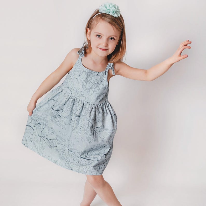 Cute toddler summer dress sewn from a printable sewing pattern PDF.